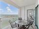 Balcony with table, chairs, and stunning ocean views at 258 Golden Gate Pt # 801, Sarasota, FL 34236