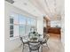 Eat-in kitchen featuring a dining table and a view of the water at 258 Golden Gate Pt # 801, Sarasota, FL 34236