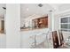 Open kitchen with granite counters, modern appliances, and a breakfast bar with seating at 258 Golden Gate Pt # 801, Sarasota, FL 34236