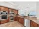 Spacious kitchen with stainless steel appliances, granite countertops, and water views at 258 Golden Gate Pt # 801, Sarasota, FL 34236