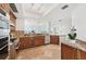 Modern kitchen boasting stainless steel appliances, granite countertops, and natural wood cabinets at 258 Golden Gate Pt # 801, Sarasota, FL 34236