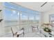 Living room featuring floor to ceiling windows with ocean view at 258 Golden Gate Pt # 801, Sarasota, FL 34236