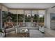 Bright living room with large windows offering scenic views and comfortable seating at 3080 Grand Bay Blvd # 515, Longboat Key, FL 34228