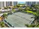 Well-maintained tennis court with surrounding landscaping at 3080 Grand Bay Blvd # 515, Longboat Key, FL 34228