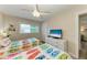 Twin beds in a bedroom with white dresser and TV at 312 Hardin Ave, Anna Maria, FL 34216