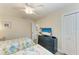 Bedroom with twin beds, dresser, and TV at 312 Hardin Ave, Anna Maria, FL 34216