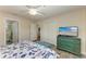 Spacious bedroom with a large TV and ensuite bathroom access at 312 Hardin Ave, Anna Maria, FL 34216