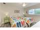 Bedroom featuring twin beds with flip-flop bedding and ceiling fan at 312 Hardin Ave, Anna Maria, FL 34216