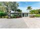 Mid-century modern home with a landscaped front yard at 312 Hardin Ave, Anna Maria, FL 34216