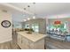 Open concept kitchen with island and dining area at 312 Hardin Ave, Anna Maria, FL 34216