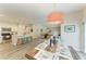 Open concept kitchen with island and dining area at 312 Hardin Ave, Anna Maria, FL 34216