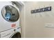 Laundry room with washer, dryer, and coat hooks at 312 Hardin Ave, Anna Maria, FL 34216