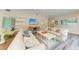 Spacious living room with comfortable seating and a large TV at 312 Hardin Ave, Anna Maria, FL 34216