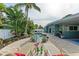 Enjoy this gorgeous pool and patio area with lounge chairs at 312 Hardin Ave, Anna Maria, FL 34216