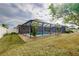 Large backyard with screened pool and spacious patio area at 3215 Lake View Blvd, Port Charlotte, FL 33948
