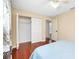 Bedroom with light blue bedding and hardwood floors, and a closet at 3215 Lake View Blvd, Port Charlotte, FL 33948