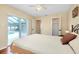 Bedroom with beige bedding and access to pool view at 3215 Lake View Blvd, Port Charlotte, FL 33948