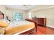 Bright bedroom with hardwood floors and pool view at 3215 Lake View Blvd, Port Charlotte, FL 33948