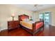Bedroom with hardwood floors, sliding door to pool at 3215 Lake View Blvd, Port Charlotte, FL 33948