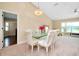 Elegant dining room featuring a glass-top table and chandelier at 3215 Lake View Blvd, Port Charlotte, FL 33948
