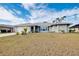 Single-story home with well-manicured lawn and driveway at 3215 Lake View Blvd, Port Charlotte, FL 33948