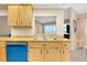Kitchen features light wood cabinets and a double sink at 3215 Lake View Blvd, Port Charlotte, FL 33948