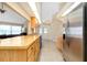 Kitchen with stainless steel refrigerator and light wood cabinets at 3215 Lake View Blvd, Port Charlotte, FL 33948