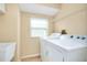 Bright laundry room with washer and dryer at 3215 Lake View Blvd, Port Charlotte, FL 33948