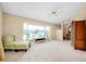 Living room with bay window, seating area, and a wooden cabinet at 3215 Lake View Blvd, Port Charlotte, FL 33948