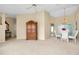 Open living room and dining area with a large wooden cabinet at 3215 Lake View Blvd, Port Charlotte, FL 33948