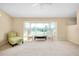 Spacious living room featuring a bay window and neutral color palette at 3215 Lake View Blvd, Port Charlotte, FL 33948