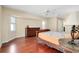 Main bedroom with hardwood floors, ceiling fan, and ample closet space at 3215 Lake View Blvd, Port Charlotte, FL 33948