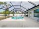 Screened pool with patio and backyard view at 3215 Lake View Blvd, Port Charlotte, FL 33948