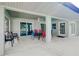 Spacious patio with seating area adjacent to the pool and home at 3215 Lake View Blvd, Port Charlotte, FL 33948