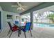 Relaxing poolside patio with table and chairs, perfect for outdoor dining at 3215 Lake View Blvd, Port Charlotte, FL 33948