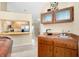 Convenient wet bar with cabinets and a small sink at 3215 Lake View Blvd, Port Charlotte, FL 33948