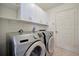 Bright laundry room with washer, dryer, and ample storage at 4423 Useppa Dr, Bradenton, FL 34203