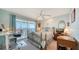 Bright bedroom with water views, featuring a comfortable bed and a workspace at 4800 Gulf Of Mexico Dr # Ph 3, Longboat Key, FL 34228