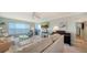 Spacious living room boasts stunning water views and ample seating at 4800 Gulf Of Mexico Dr # Ph 3, Longboat Key, FL 34228
