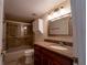 Bathroom features a tub shower combo and granite vanity at 4802 Kestral Park Cir # 22, Sarasota, FL 34231