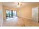 Bright bedroom with tile floor and access to a private patio at 4802 Kestral Park Cir # 22, Sarasota, FL 34231