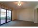 Spacious bedroom with patio access and ceiling fan at 4802 Kestral Park Cir # 22, Sarasota, FL 34231