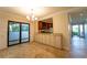 Elegant dining area with tile floors and access to a patio at 4802 Kestral Park Cir # 22, Sarasota, FL 34231