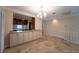 Bright dining room with tile floors and built-in cabinetry at 4802 Kestral Park Cir # 22, Sarasota, FL 34231