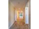 Hallway with tile floors and neutral walls at 4802 Kestral Park Cir # 22, Sarasota, FL 34231