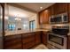 Modern kitchen with stainless steel appliances and granite counters at 4802 Kestral Park Cir # 22, Sarasota, FL 34231