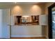 Kitchen with granite countertops and pass-through to dining area at 4802 Kestral Park Cir # 22, Sarasota, FL 34231