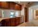 Kitchen features granite countertops, stainless steel appliances, and ample wood cabinets at 4802 Kestral Park Cir # 22, Sarasota, FL 34231