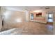 Open living room with views to kitchen at 4802 Kestral Park Cir # 22, Sarasota, FL 34231