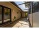 Private patio with covered screened lanai and tile flooring at 4802 Kestral Park Cir # 22, Sarasota, FL 34231